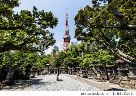 The Mausoleum of Tokugawa Shoguns with the Tokyo Tower at the Zojo-ji in Minato, Tokyo, Japan. The graves of the six Tokugawa shoguns are joined with those of other family members. 136358161
