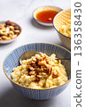Millet porridge with mixed nuts 136358430