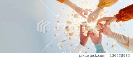 Hands reaching up towards falling confetti, symbolizing celebration and unity. 136358983