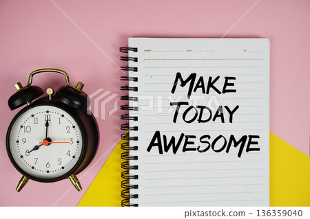 Make Today Awesome text written on notepad with alarm clock on pink background 136359040