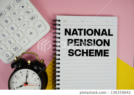 National Pension Scheme text written on notepad with calculator and alarm clock on pink background National Pension Scheme text written on notepad with calculator and alarm clock on pink background 136359042