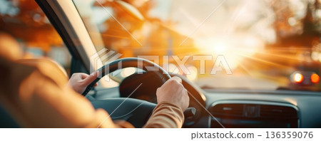 Person driving car on sunny day, road ahead. Person driving car on sunny day, road ahead. 136359076