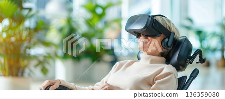 Senior woman in a wheelchair using virtual reality headset. Senior woman in a wheelchair using virtual reality headset. 136359080