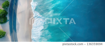Aerial view of a sandy beach and turquoise ocean waves. 136359094