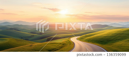 Serene winding road through rolling green hills, bathed in golden sunrise light. Serene winding road through rolling green hills, bathed in golden sunrise light. 136359099