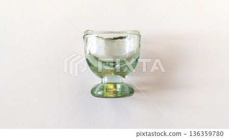 Glass eye wash cup isolated on white background. Medicine concept 136359780