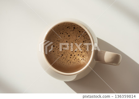 Top View on Frothy Coffee in Ceramic Mug. Cozy Morning Flatlay Top View on Frothy Coffee in Ceramic Mug. Cozy Morning Flatlay 136359814