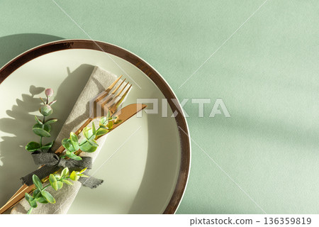 Elegant Table Setting with Napkin and Gold Cutlery. Stylish Easter Spring Arrangement under Sun Light 136359819
