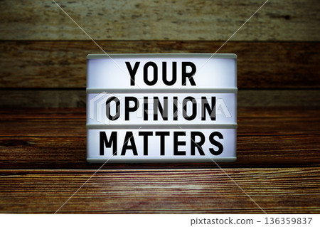 Lightbox with text "Your Opinion Matters" on wooden background Lightbox with text "Your Opinion Matters" on wooden background 136359837