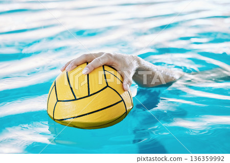 Ball, hand and water polo, swimming pool and sports with fitness, athlete and training for game. Person, swimmer and equipment with exercise, closeup and aquatic workout with challenge and match 136359992