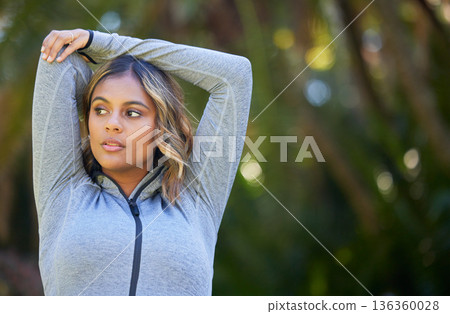 Nature, fitness and young woman doing a warm up for an outdoor workout or training. Sports, happy and female athlete stretching her arms in a park for a running cardio exercise in a green garden. Nature, fitness and young woman doing a warm up for an outdoor workout or training. Sports, happy and female athlete stretching her arms in a park for a running cardio exercise in a green garden. 136360028