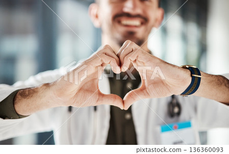 Hospital doctor, happy man and closeup heart hands for surgeon healthcare, medical services and cardiology health. Medicine satisfaction, emoji love icon and clinic person with nursing wellness care Hospital doctor, happy man and closeup heart hands for surgeon healthcare, medical services and cardiology health. Medicine satisfaction, emoji love icon and clinic person with nursing wellness care 136360093