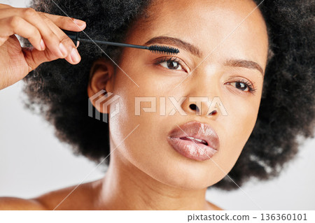 Skincare, cosmetics and eyebrow brush for beauty with african girl in grey studio or background. Makeup, brow and woman with facial cosmetology for dermatology or glow for elegant natural face. Skincare, cosmetics and eyebrow brush for beauty with african girl in grey studio or background. Makeup, brow and woman with facial cosmetology for dermatology or glow for elegant natural face. 136360101