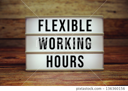 Lightbox with text "Flexible Working Hours" on wooden background Lightbox with text "Flexible Working Hours" on wooden background 136360156