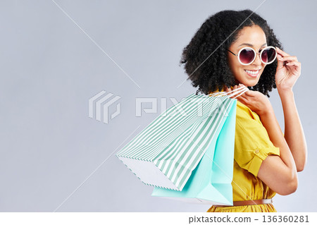 Shopping, bag and woman happy for retail sale, promotion or excited for discount on studio, mockup or grey background. Customer, portrait or girl to shop for fashion or sales on luxury clothing Shopping, bag and woman happy for retail sale, promotion or excited for discount on studio, mockup or grey background. Customer, portrait or girl to shop for fashion or sales on luxury clothing 136360281