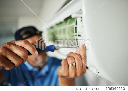 Electrician, hands and air conditioning with man and screwdriver for maintenance, ventilation or power. Engineering, electricity and inspection with closeup of technician for ac repair and contractor 136360310