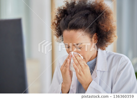 Woman, sick doctor and blowing nose in hospital with allergy, influenza or virus. Black female healthcare professional, tissue and allergies in clinic for problem, cold and bacteria in medical office Woman, sick doctor and blowing nose in hospital with allergy, influenza or virus. Black female healthcare professional, tissue and allergies in clinic for problem, cold and bacteria in medical office 136360359