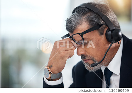 Stress, sales and man in a call center with a headache from telemarketing or technical support. Sad, fail or a mature customer service employee or boss with a mistake or problem with communication 136360409