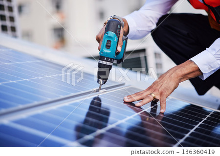 Solar panels, person hands and tools for engineering maintenance, electrical repair and rooftop contractor, Grid, drill and industrial worker or electrician for eco photovoltaic installation in city Solar panels, person hands and tools for engineering maintenance, electrical repair and rooftop contractor, Grid, drill and industrial worker or electrician for eco photovoltaic installation in city 136360419