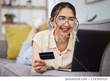 Happy woman, credit card and money with laptop on sofa for ecommerce payment, fintech password and online shopping. Female customer, computer and banking code for financial sales promotion at home Happy woman, credit card and money with laptop on sofa for ecommerce payment, fintech password and online shopping. Female customer, computer and banking code for financial sales promotion at home 136360429