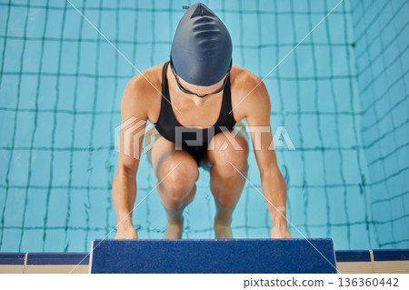 Swimming pool, sports and woman for back stroke for exercise, training and workout for competition in gym. Fitness, water sport and female swimmer on start block for race, challenge and performance Swimming pool, sports and woman for back stroke for exercise, training and workout for competition in gym. Fitness, water sport and female swimmer on start block for race, challenge and performance 136360442