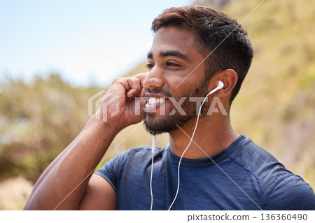 Fitness, happy man or runner with music in training, wellness or cardio exercise outdoors in nature. Headphones, radio audio or healthy athlete listening or streaming podcast to start running workout Fitness, happy man or runner with music in training, wellness or cardio exercise outdoors in nature. Headphones, radio audio or healthy athlete listening or streaming podcast to start running workout 136360490