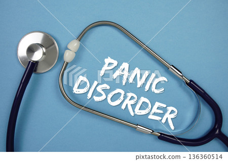 Panic Disorders text with stethoscope on blue background 136360514