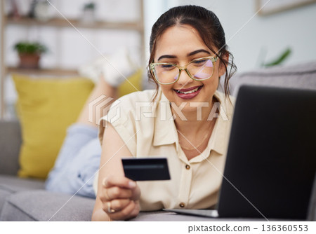 Woman, credit card and finance with laptop on sofa for digital payment, fintech password and online shopping. Happy female customer, computer and banking code for financial sales investment at home Woman, credit card and finance with laptop on sofa for digital payment, fintech password and online shopping. Happy female customer, computer and banking code for financial sales investment at home 136360553