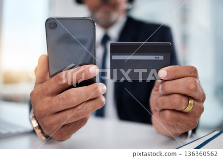 Hands, phone and credit card man in office for payment, ecommerce or budget for shopping in call center. Consultant, crm and banking in closeup for loan, fintech or bills in telemarketing workplace Hands, phone and credit card man in office for payment, ecommerce or budget for shopping in call center. Consultant, crm and banking in closeup for loan, fintech or bills in telemarketing workplace 136360562
