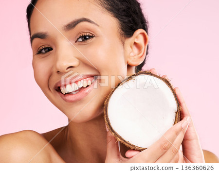 Woman face, coconut fruit and beauty, healthy skincare or vegan cream on pink studio background. Portrait of Mexican person in natural product for dermatology, eco friendly cosmetics and oil benefits 136360626