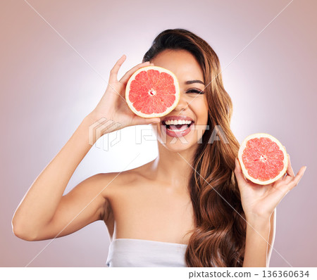 Vitamin c, grapefruit and portrait of woman with healthy, natural or organic beauty isolated in a brown studio background. Excited, happy and young female person with citrus for skincare or detox Vitamin c, grapefruit and portrait of woman with healthy, natural or organic beauty isolated in a brown studio background. Excited, happy and young female person with citrus for skincare or detox 136360634