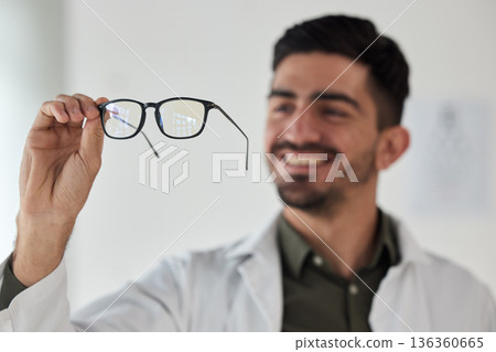 Hands of man, doctor and optician with glasses for vision, eyesight and prescription eye care. Happy optometrist check frame of lens for eyewear, test and consulting for optical healthcare assessment Hands of man, doctor and optician with glasses for vision, eyesight and prescription eye care. Happy optometrist check frame of lens for eyewear, test and consulting for optical healthcare assessment 136360665
