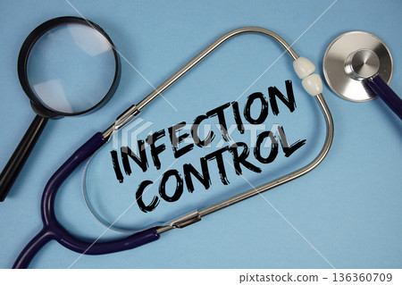Infection Control text with Stethoscope and magnifying glass on blue background Infection Control text with Stethoscope and magnifying glass on blue background 136360709