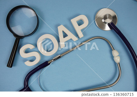 SOAP abbreviation of Subjective, Objective, Assessment and Plan alphabet letters with magnifying glass and stethoscope on blue background SOAP abbreviation of Subjective, Objective, Assessment and Plan alphabet letters with magnifying glass and stethoscope on blue background 136360715
