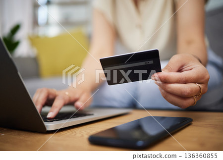 Hands, credit card and ecommerce on laptop in home for digital payment, fintech password and online shopping. Closeup of person, computer and customer banking for financial bills, budget and account Hands, credit card and ecommerce on laptop in home for digital payment, fintech password and online shopping. Closeup of person, computer and customer banking for financial bills, budget and account 136360855