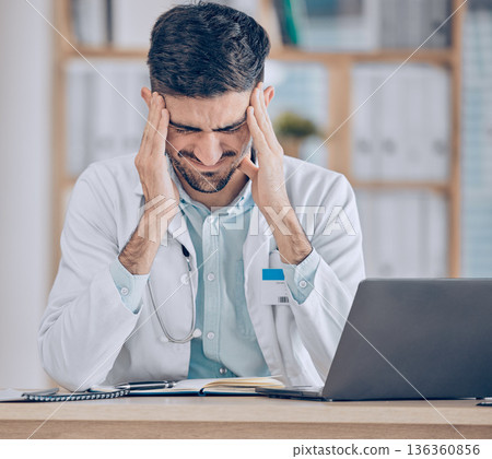 Frustrated man, doctor and headache in stress, mistake or debt from burnout, pain or deadline at the hospital. Male person or medical employee in anxiety, depression or mental health at the clinic Frustrated man, doctor and headache in stress, mistake or debt from burnout, pain or deadline at the hospital. Male person or medical employee in anxiety, depression or mental health at the clinic 136360856