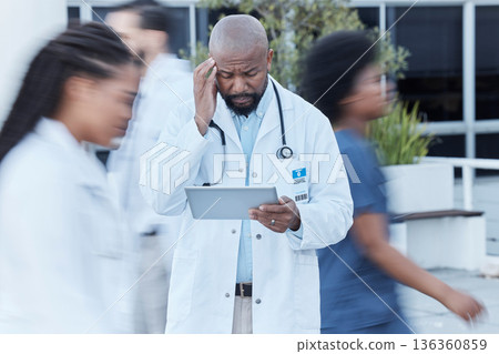 Tablet, black man and doctor with stress in busy hospital, fatigue or burnout. Tech, medical professional or person with problem, crisis or challenge, headache or anxiety in mistake, fail or disaster 136360859