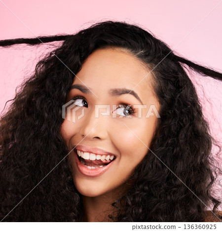 Beauty, curly hair and smile with face of woman in studio for cosmetics, textures and salon treatment. Shampoo, skincare and hairstyle with model on pink background for self care, facial and glow 136360925