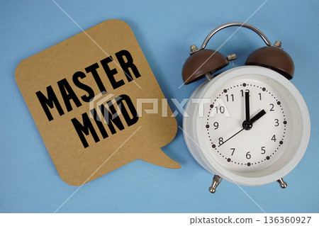 Mastermind text with alarm clock on blue background 136360927