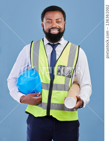 Happy black man, portrait and construction blueprint in studio for safety inspection, maintenance or architecture. Engineering, contractor and industrial manager with building plan on blue background Happy black man, portrait and construction blueprint in studio for safety inspection, maintenance or architecture. Engineering, contractor and industrial manager with building plan on blue background 136361002