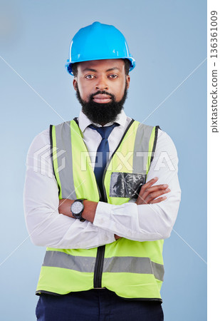 Engineering, man or serious portrait with arms crossed in studio in development, building construction or industrial technician. Black male architect, contractor or project manager on blue background Engineering, man or serious portrait with arms crossed in studio in development, building construction or industrial technician. Black male architect, contractor or project manager on blue background 136361009