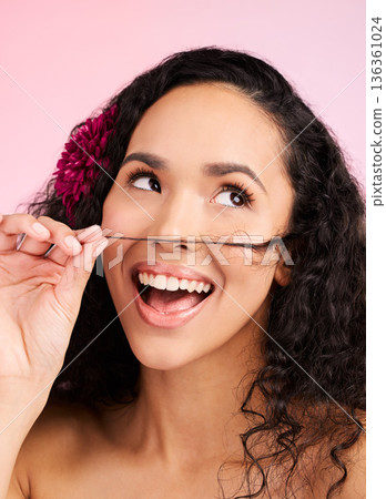 Hair care, wellness and young woman in a studio with natural, beautiful and long curls. Happy, smile and female model from Mexico with a shiny salon treatment hairstyle isolated by a pink background. Hair care, wellness and young woman in a studio with natural, beautiful and long curls. Happy, smile and female model from Mexico with a shiny salon treatment hairstyle isolated by a pink background. 136361024