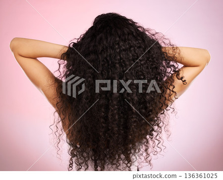 Hair, beauty and back of woman with hairstyle transformation and curly texture. Model, salon treatment and haircut shine in a studio with pink background and cosmetics with keratin and growth care Hair, beauty and back of woman with hairstyle transformation and curly texture. Model, salon treatment and haircut shine in a studio with pink background and cosmetics with keratin and growth care 136361025
