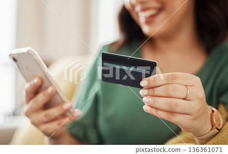 Phone, credit card closeup and woman hands with online shopping and banking at home. Ecommerce, mobile cashback and sale with digital payment and easy pay with discount and smile from web checkout 136361071