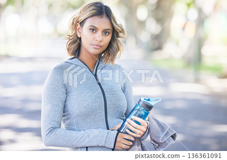Portrait, fitness and woman outdoor, exercise and water bottle with wellness, healthy and sports. Face, person and athlete outside, street or hydration with training, workout goals, athlete or liquid 136361091