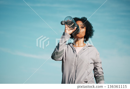 Woman, drinking water and health with fitness, hydration and workout outdoor. Plastic bottle, liquid and wellness with female athlete in nature, exercise and training with h2o and mockup space 136361115