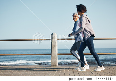 Women, beach and friends running for fitness together as morning exercise for wellness and outdoor bonding. Health, endurance and people training for marathon in Cape Town for sports workout 136361118