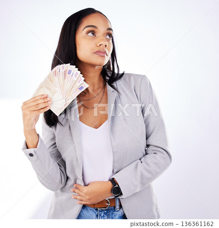 Woman, winner and money in studio from casino, award or cashback payment on white background. Poker, gambling and lady with cash prize from investment, bingo or savings success or financial freedom Woman, winner and money in studio from casino, award or cashback payment on white background. Poker, gambling and lady with cash prize from investment, bingo or savings success or financial freedom 136361162