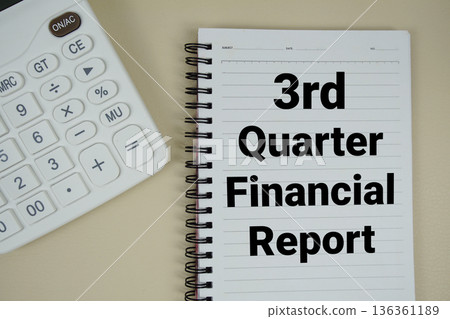 3rd Quarter Financial Report text with calculator phrase of business and financial concept 136361189