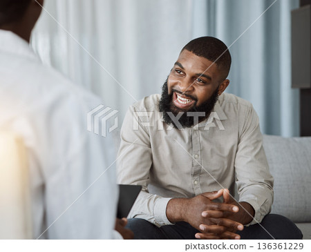 Happy black man, therapist and consultation in meeting for healthcare, mental health or therapy at the hospital. African male person talking to consultant in physiology, counseling or medical help Happy black man, therapist and consultation in meeting for healthcare, mental health or therapy at the hospital. African male person talking to consultant in physiology, counseling or medical help 136361229